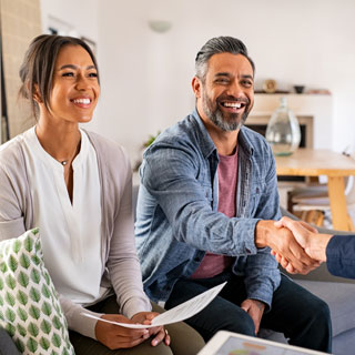 Couple talking to Mortgage Broker